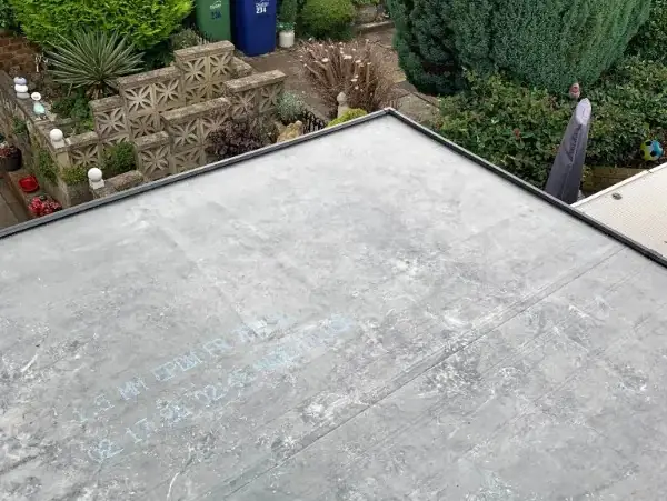 Finished grey EPDM flat roof above a garden in Sutton Coldfield