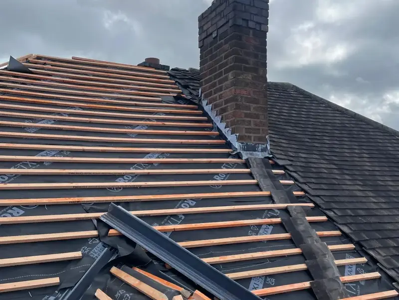 New membrane and battens around the chimney of a house in Four Oaks