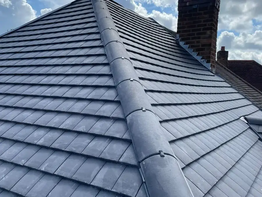 Finished slate grey tiled roof with a dry ridge in Four Oaks