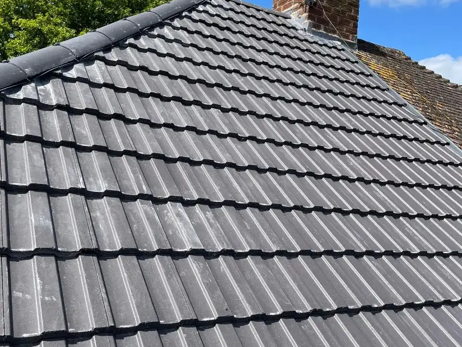 New grey interlocking tiles under a blue sky on Holly Dale Road, Erdington