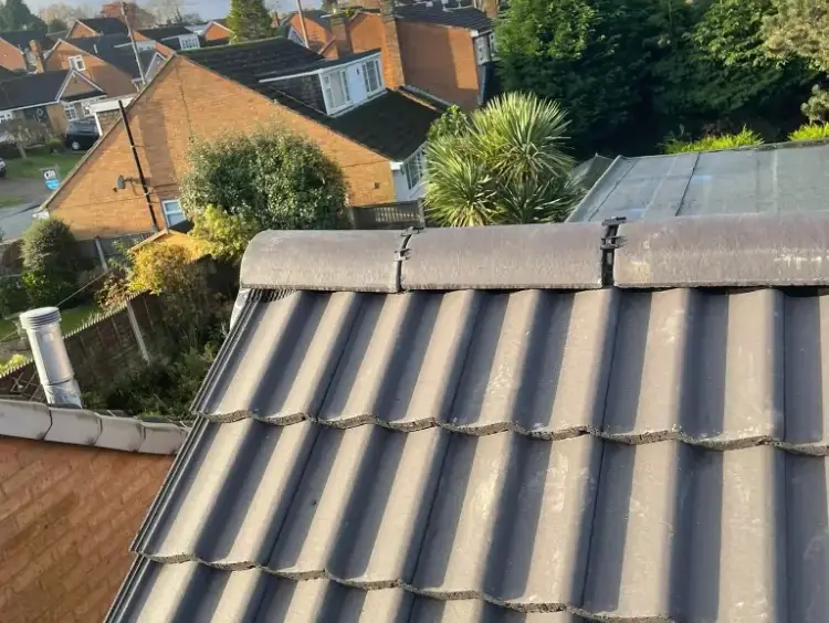 Ridge and new tiles on a re-tiled house roof in Sutton Coldfield