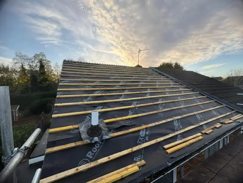 New battens and vent ready for tiles at sunset on a Birmingham home